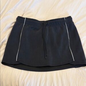 All in motion Black Mini Skort with White Trim - size medium